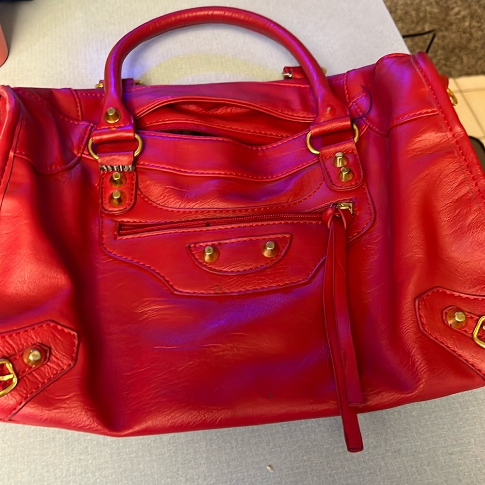 Gorgeous red shoulder bag. Perfect for daily or events.  Never worn.